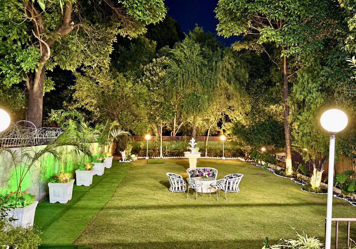 The lantern-lit lawn at Baylis House at night